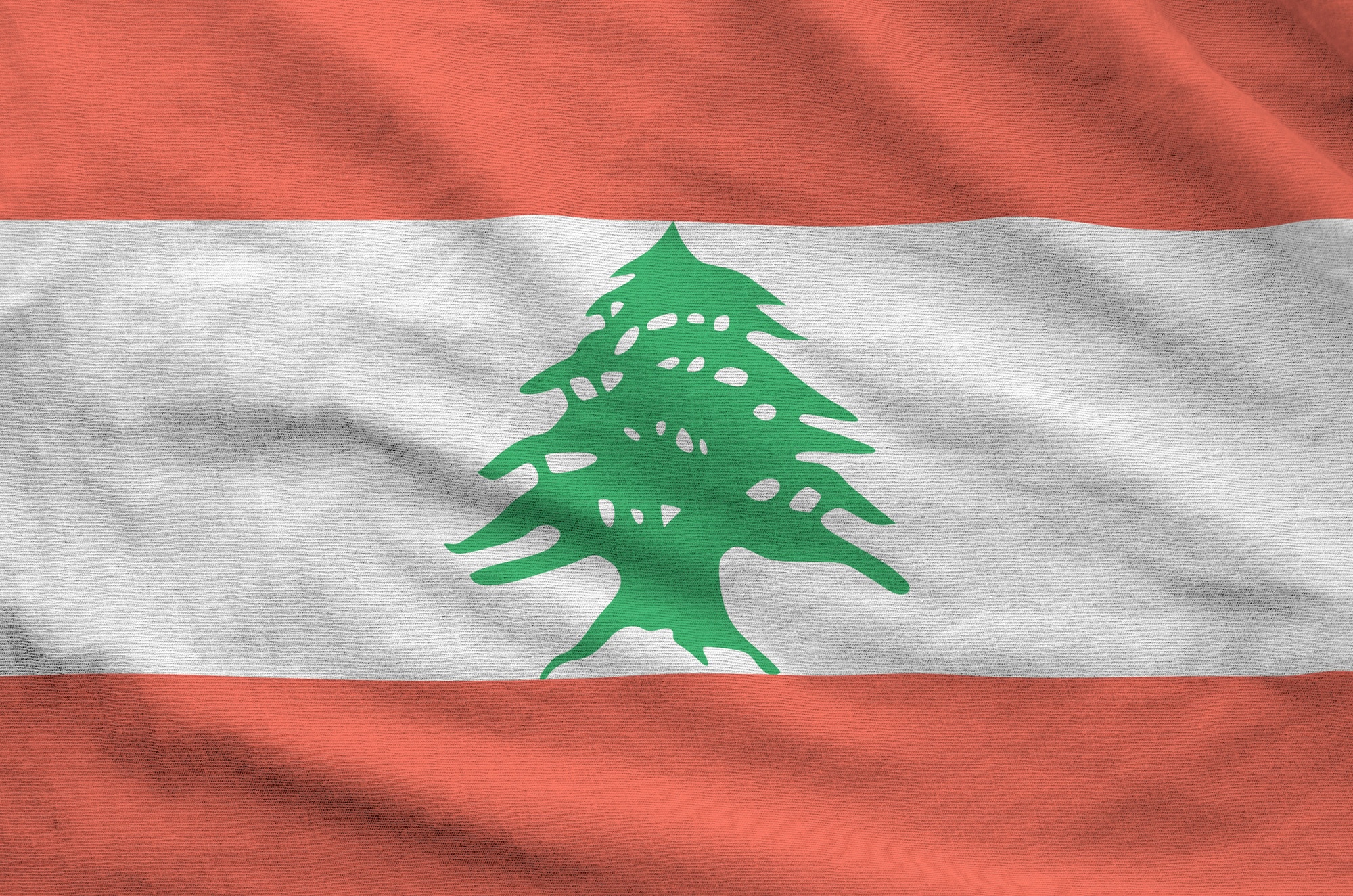 من نحن 11 Lebanon flag depicted on folded wavy fabric of old cloth